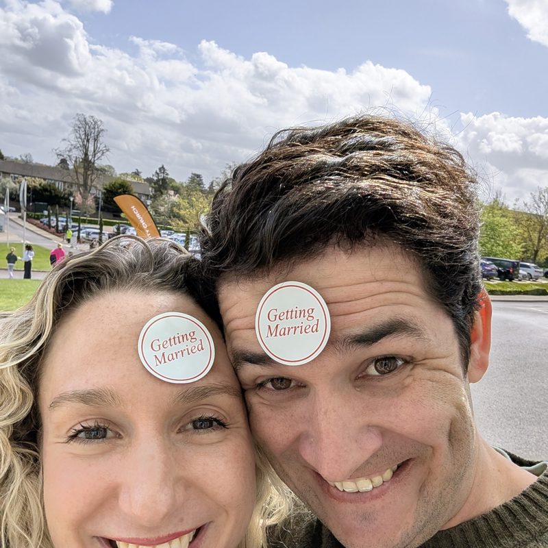 Wesley and Claire wearing “Getting Married” badges, April 2026